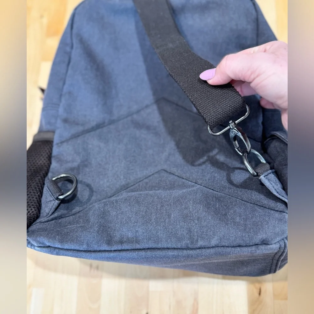 Gray Canvas Crossbody Backpack with Brown Accents Multiple Compartments Durable
